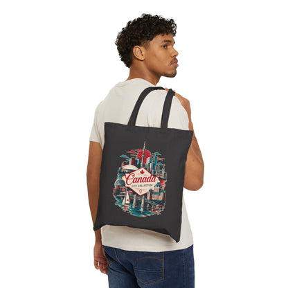 Black canvas tote bag with colorful Canada city skyline graphic, two handles.