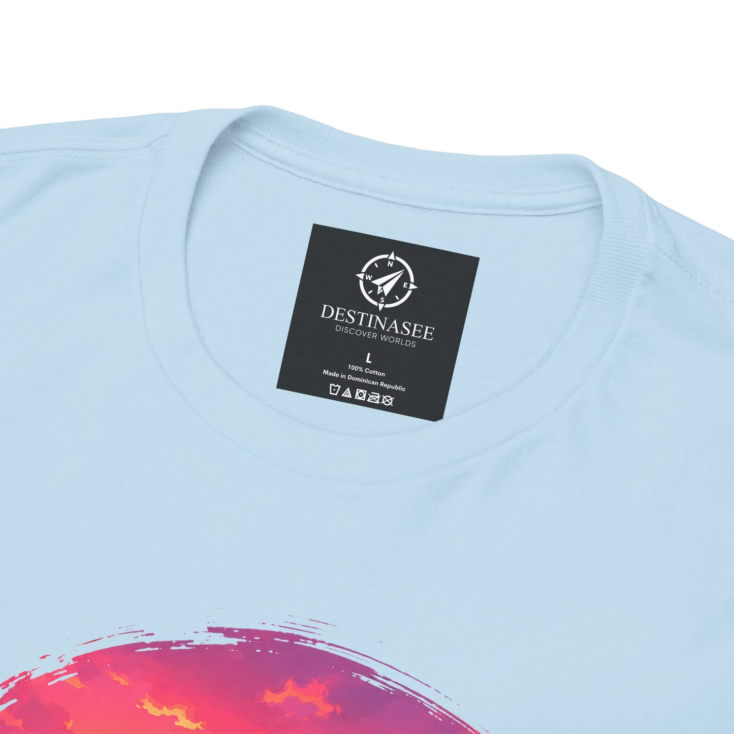 Light blue crewneck t-shirt with Destinasee chest label and coastal sunset graphic