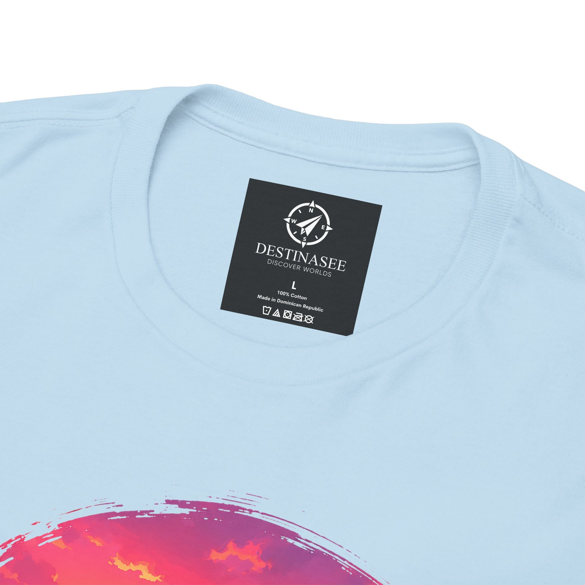 Light blue crewneck t-shirt with Destinasee chest label and coastal sunset graphic