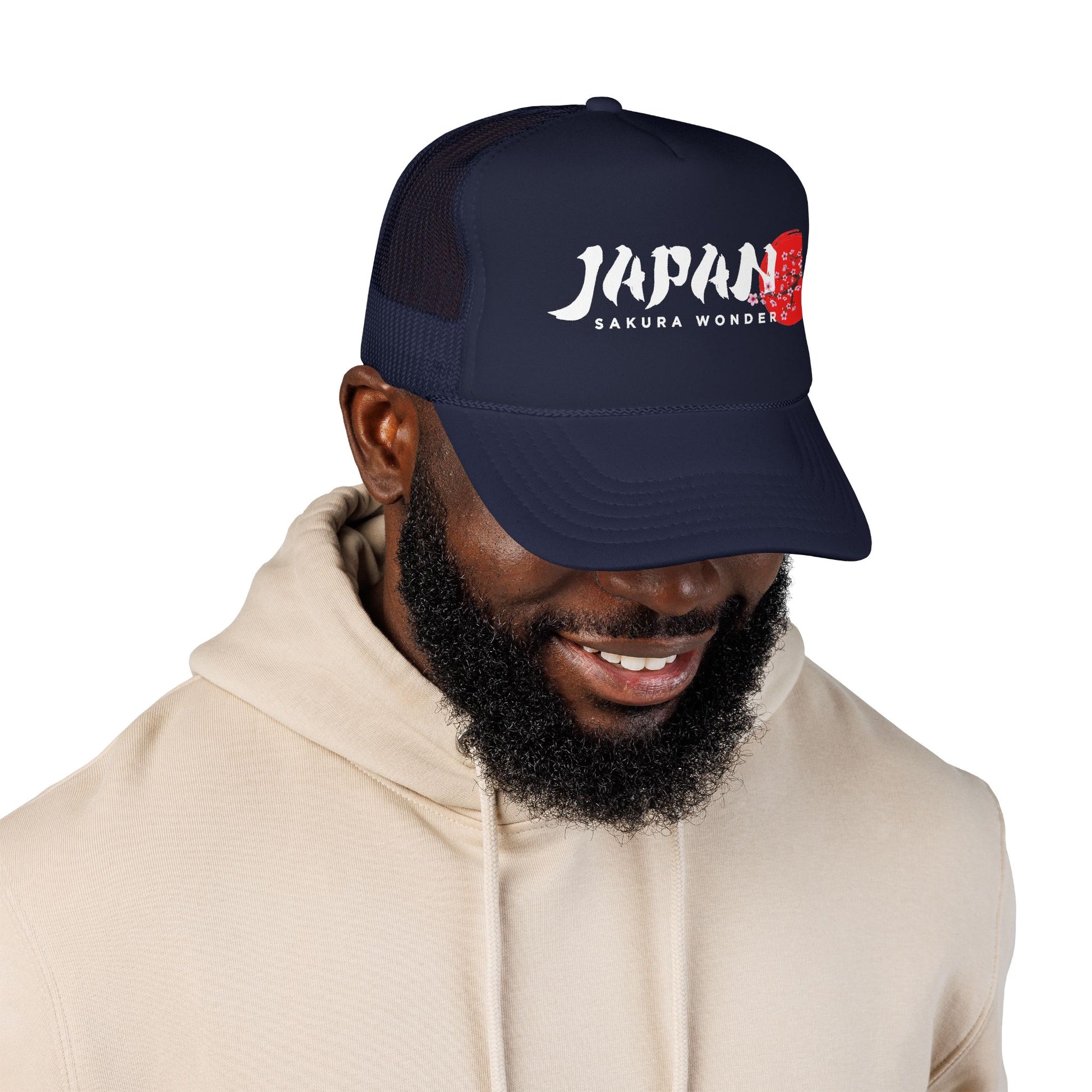 Dark navy trucker hat worn by a person, JAPAN SAKURA WONDER logo visible.
