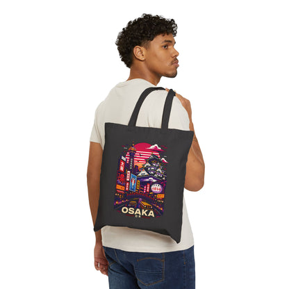 Black Osaka-themed tote bag worn on shoulder with front skyline print