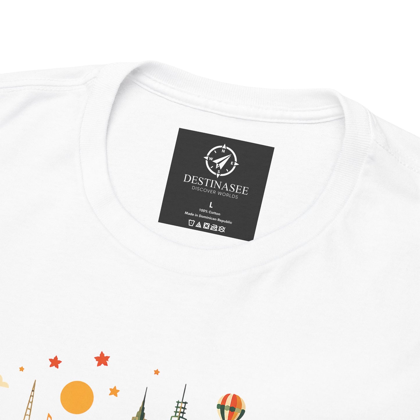 White T-shirt with black neck label patch and partial colorful Melbourne skyline artwork