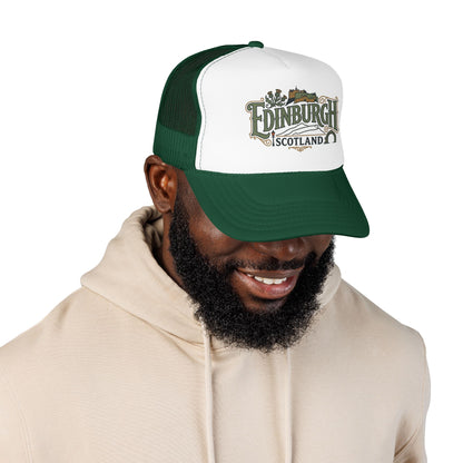 Green and white trucker hat worn by a person, with Edinburgh Scotland logo front.