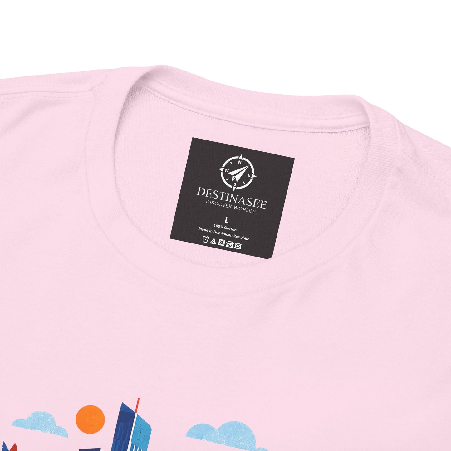 Pink Manchester Skyline T-shirt with black brand label near the collar.