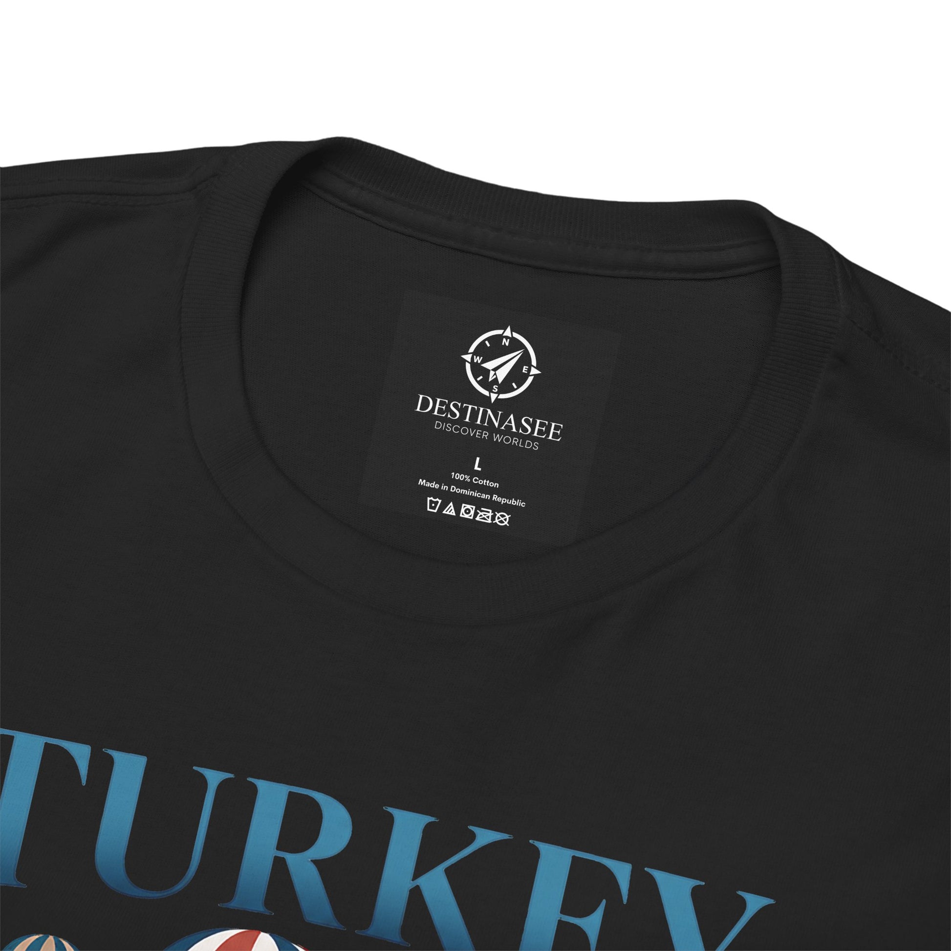 Black T-shirt neckline with small brand label and partial blue Turkey graphic