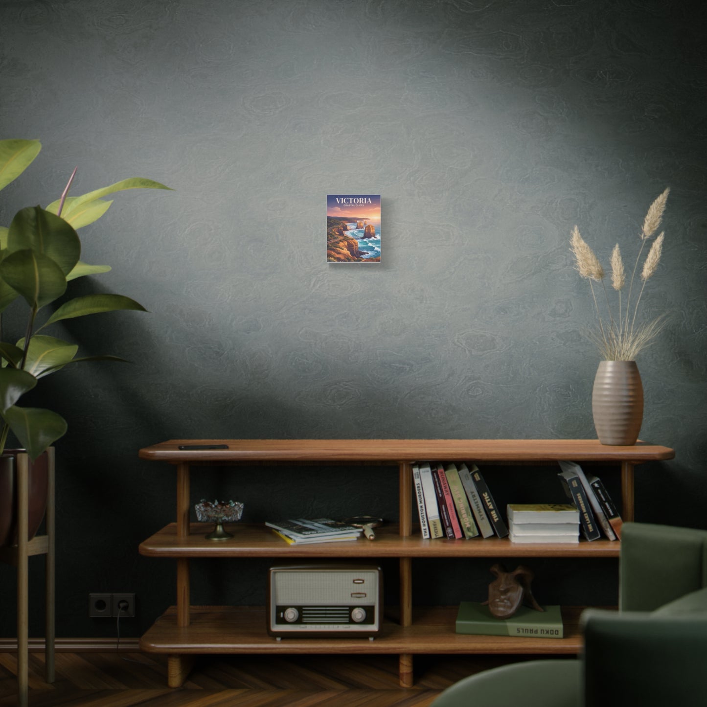 Small vertical canvas wall art on a wall, depicting coastal cliffs and ocean at sunset.