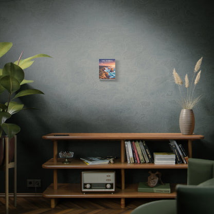 Small vertical canvas wall art on a wall, depicting coastal cliffs and ocean at sunset.