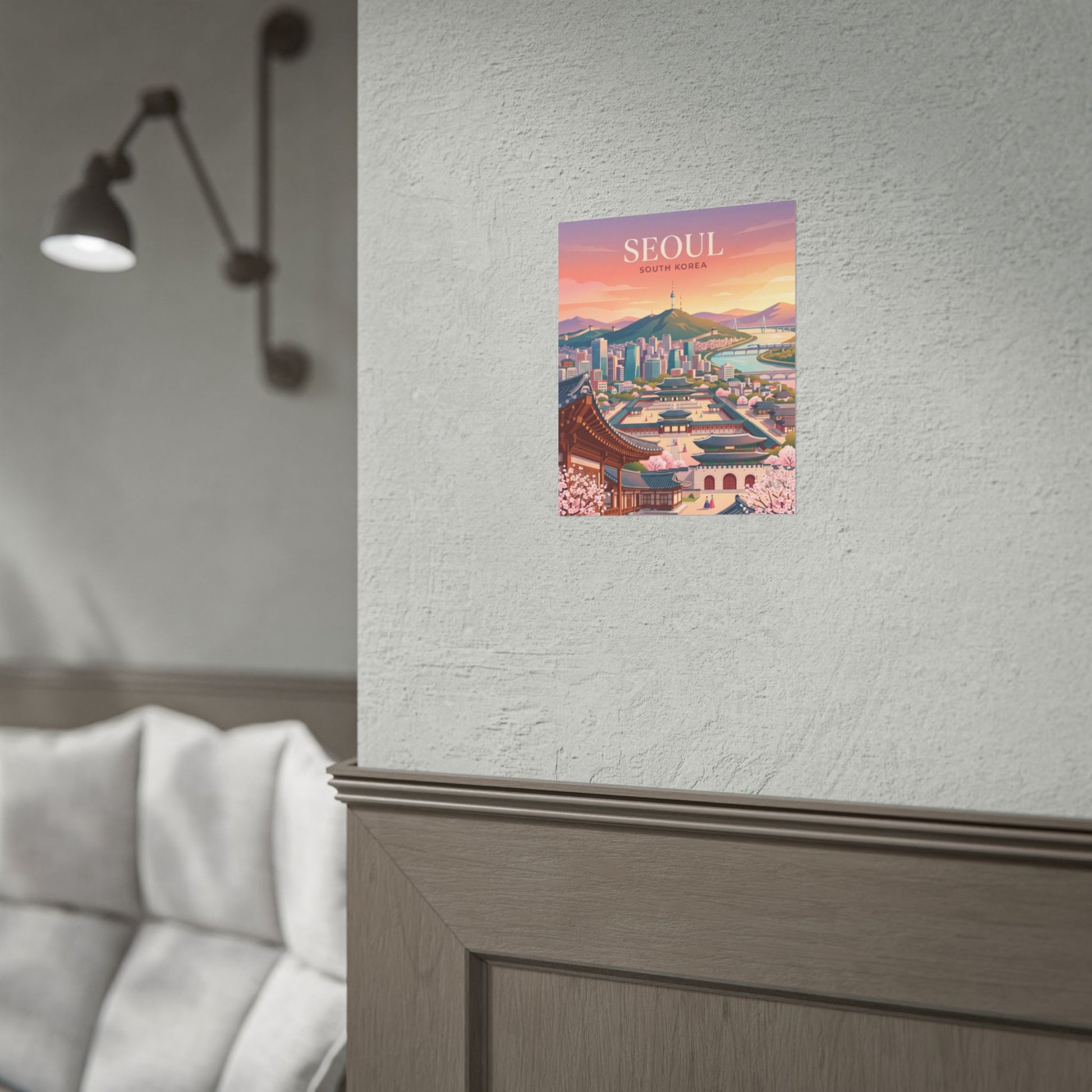 Seoul cityscape rolled poster on a wall, featuring SEOUl title and sunset skyline