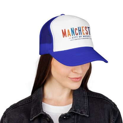 Blue and white trucker hat with embroidered Manchester City of Music logo on front panel