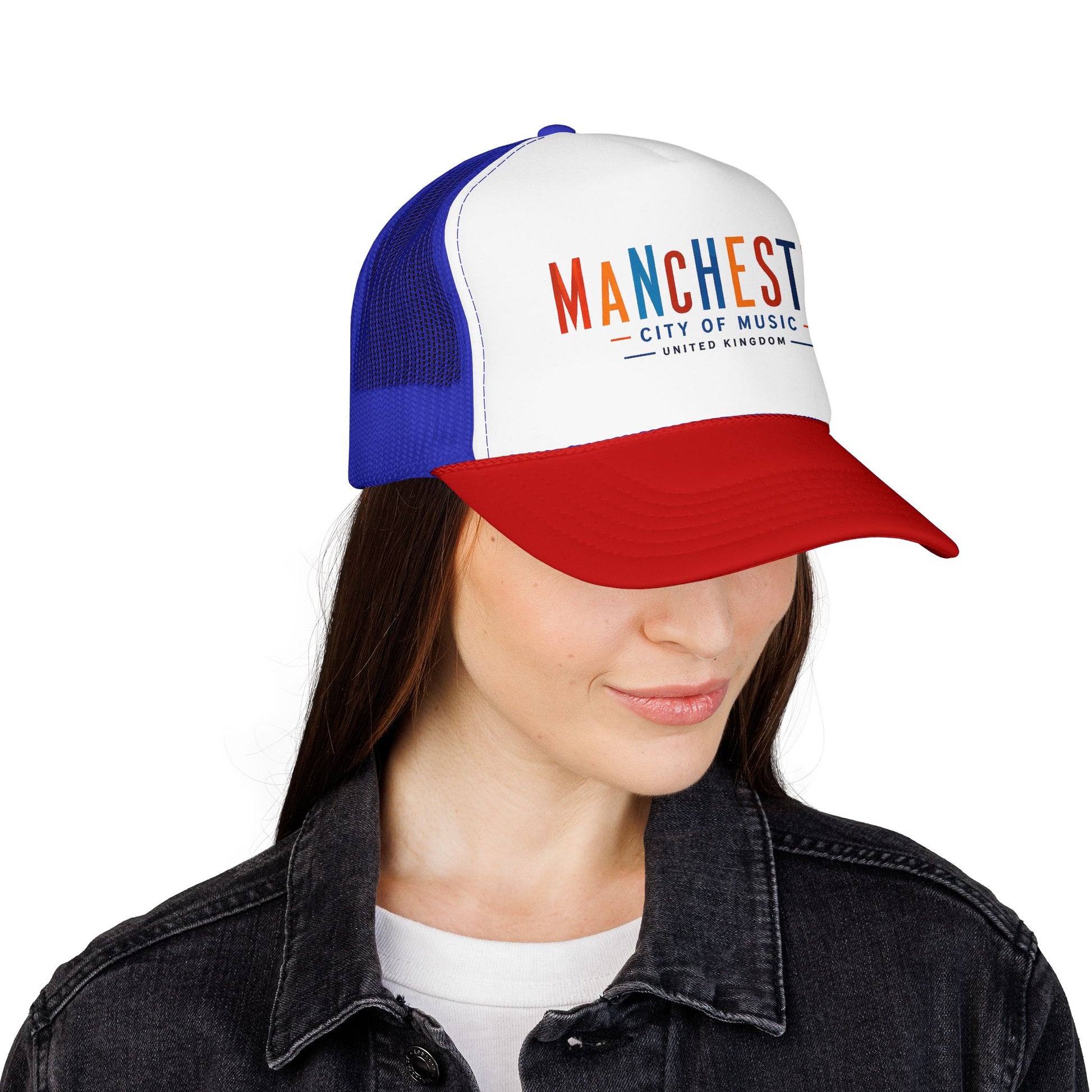 Trucker hat with white front panel, blue mesh sides, and red brim; Manchester City of Music text.