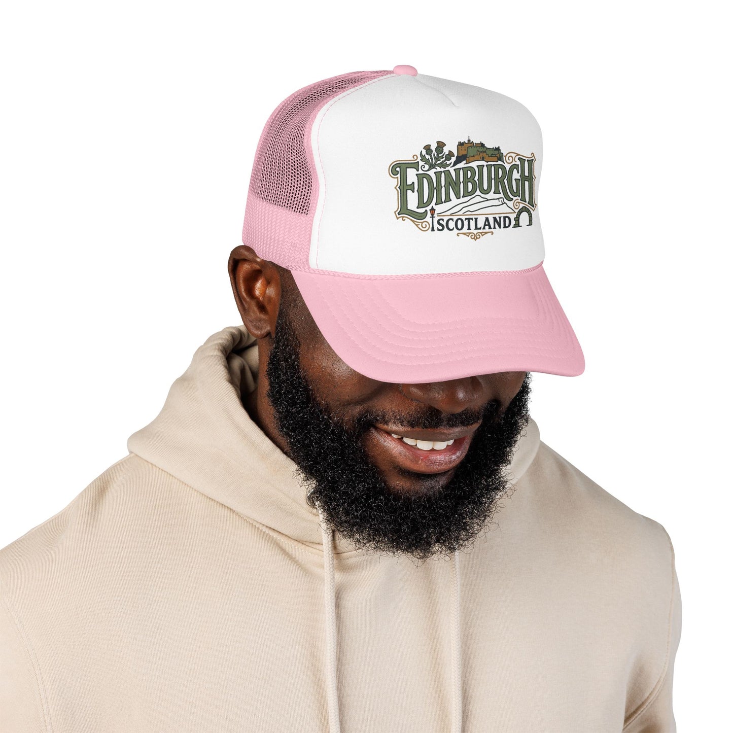 Pink and white mesh trucker hat with “Edinburgh Scotland” logo on the front panel