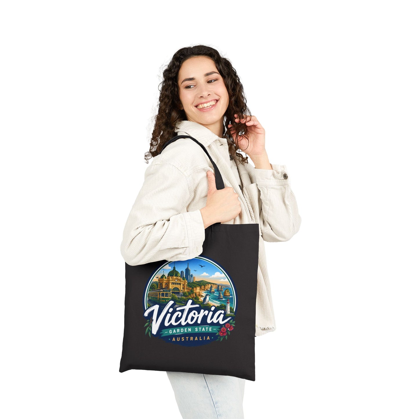 Black canvas tote bag with circular Victoria graphic and top handles