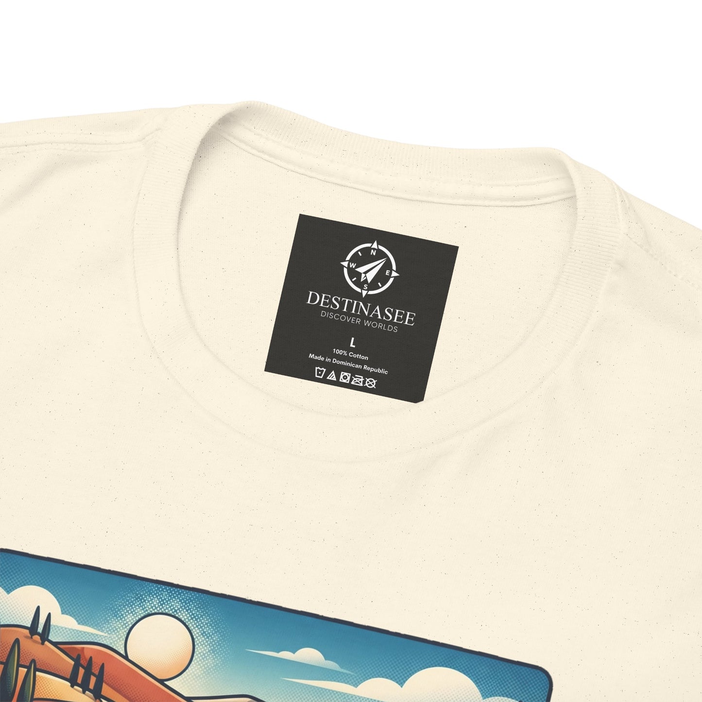 Cream T-shirt neckline with black brand label and partial scenic print detail