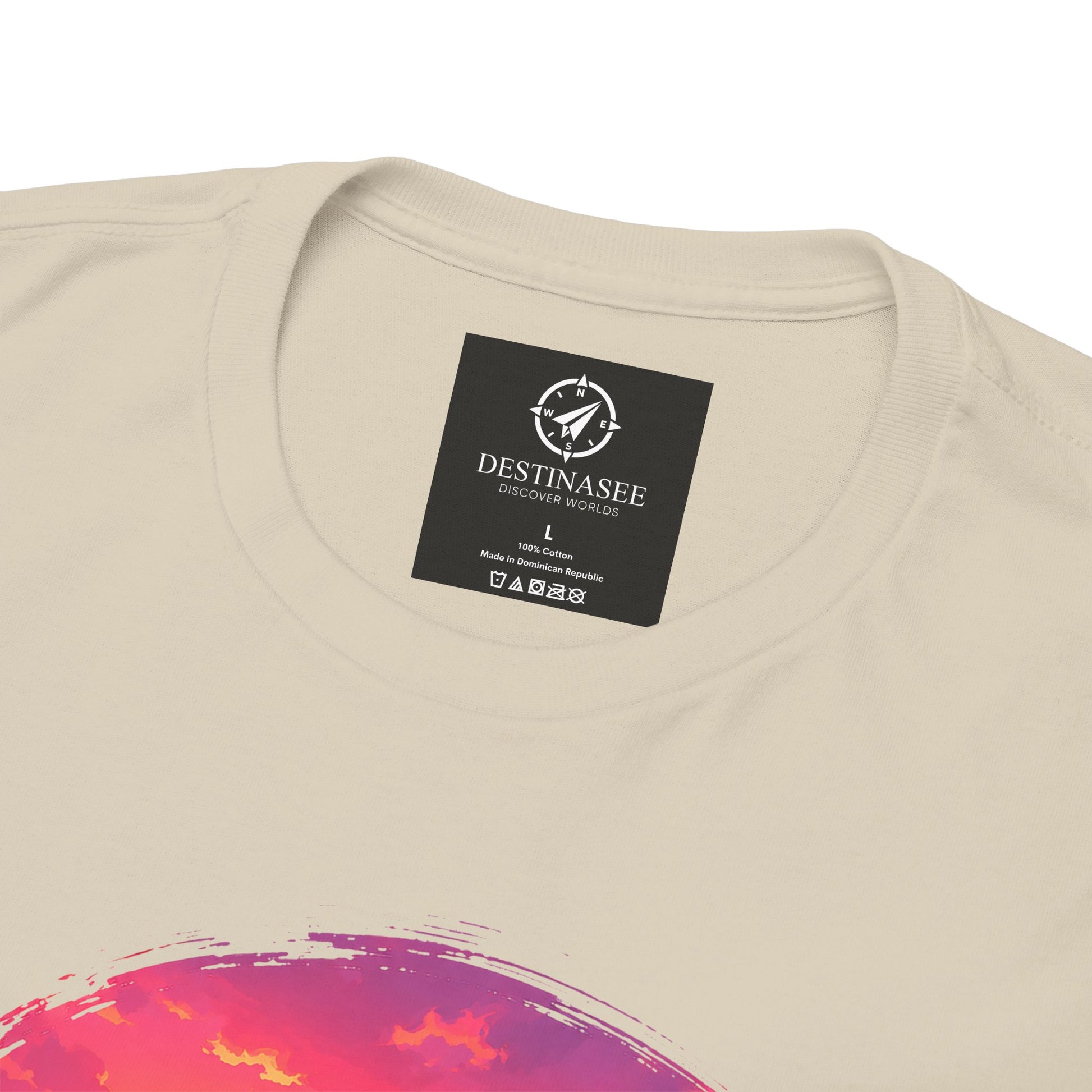 Beige crewneck t-shirt close-up with Destinasee label and colorful sunset graphic