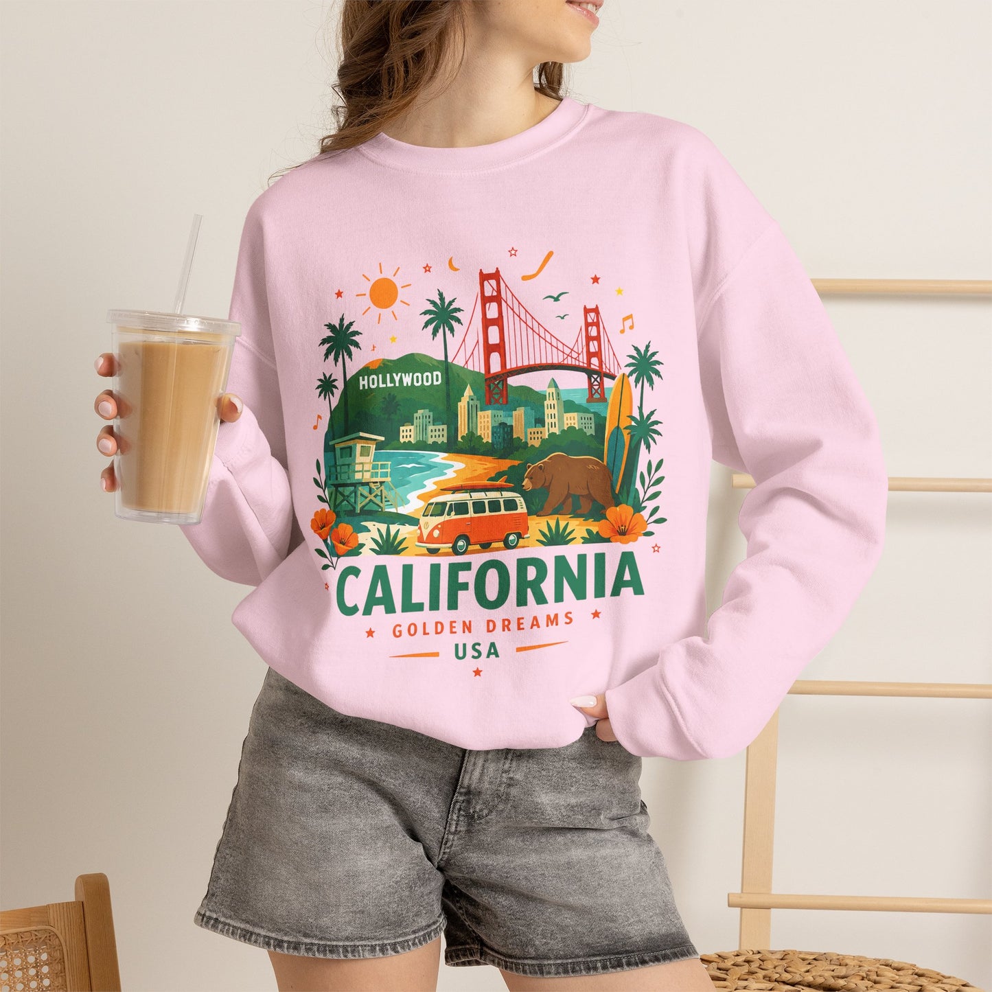 Light pink crewneck sweatshirt with California graphic front view, long sleeves.