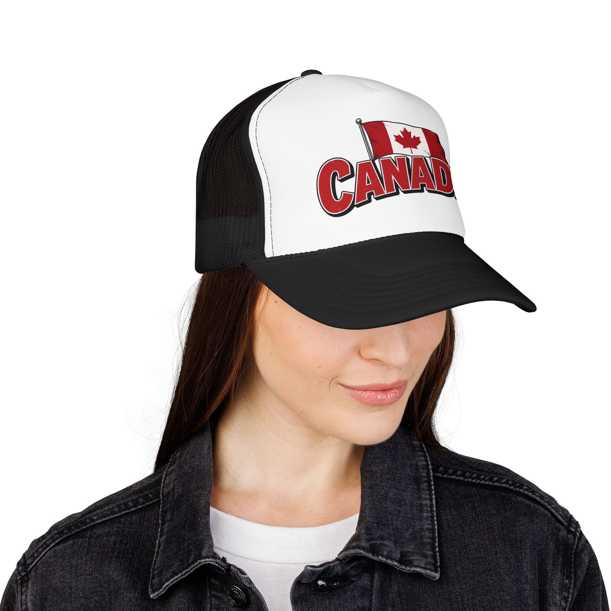 Black and white trucker hat worn by model, with Canada flag patch and red “CANADA” logo.
