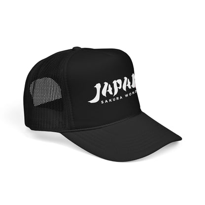 Black trucker hat, mesh back and side panel with partial JAPAN logo.