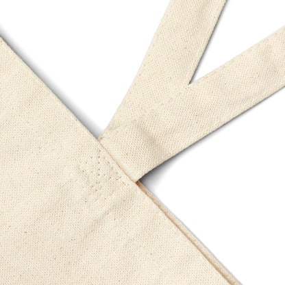 Natural canvas tote bag close-up of strap seam and stitching