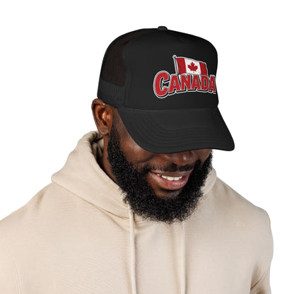 Black and white trucker hat with Canada flag patch and red “CANADA” logo on front.