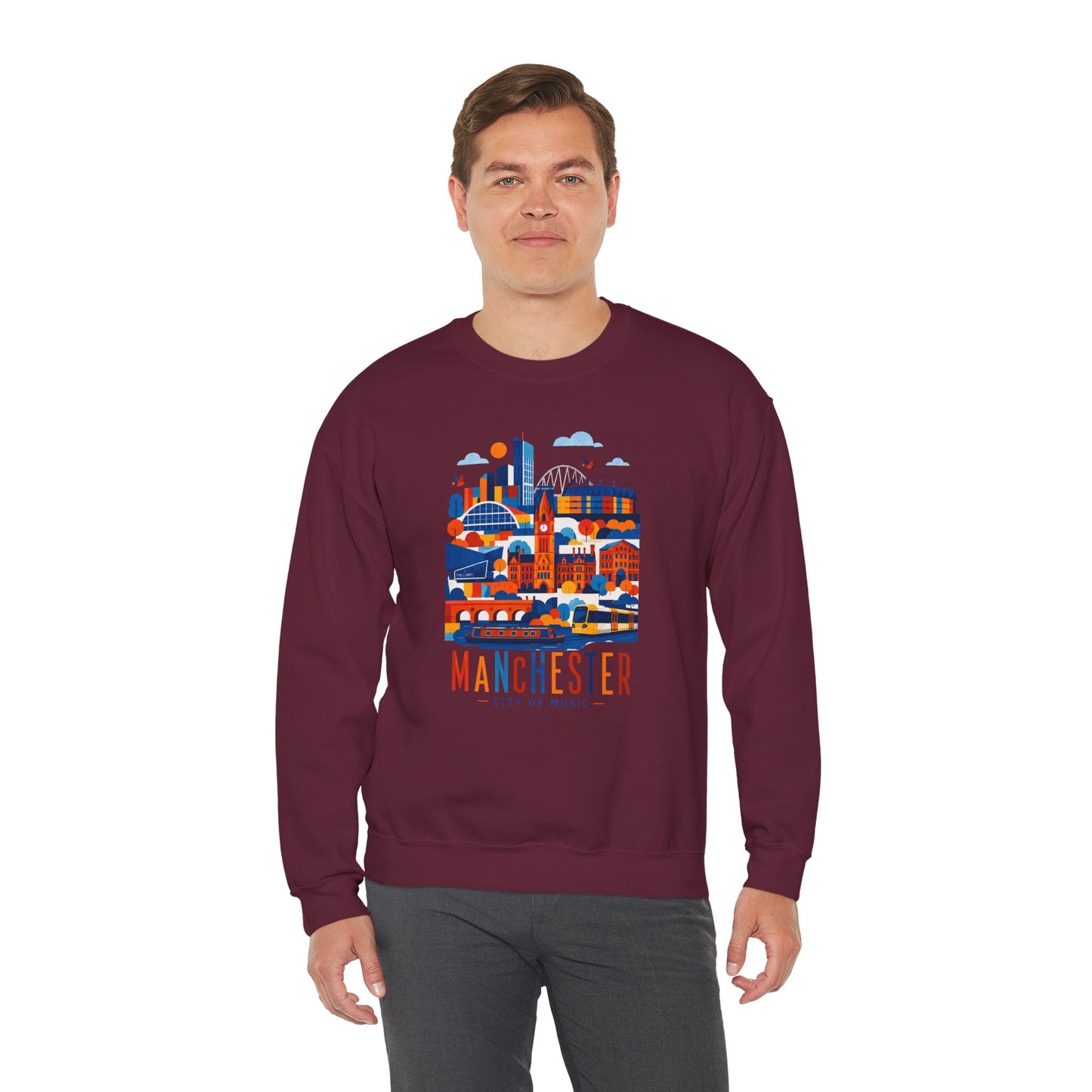 Maroon crewneck sweatshirt on model, featuring Manchester cityscape graphic on chest