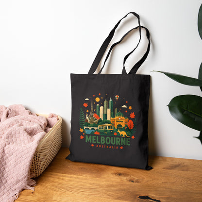 Black canvas tote bag with colorful Melbourne skyline graphic and handles