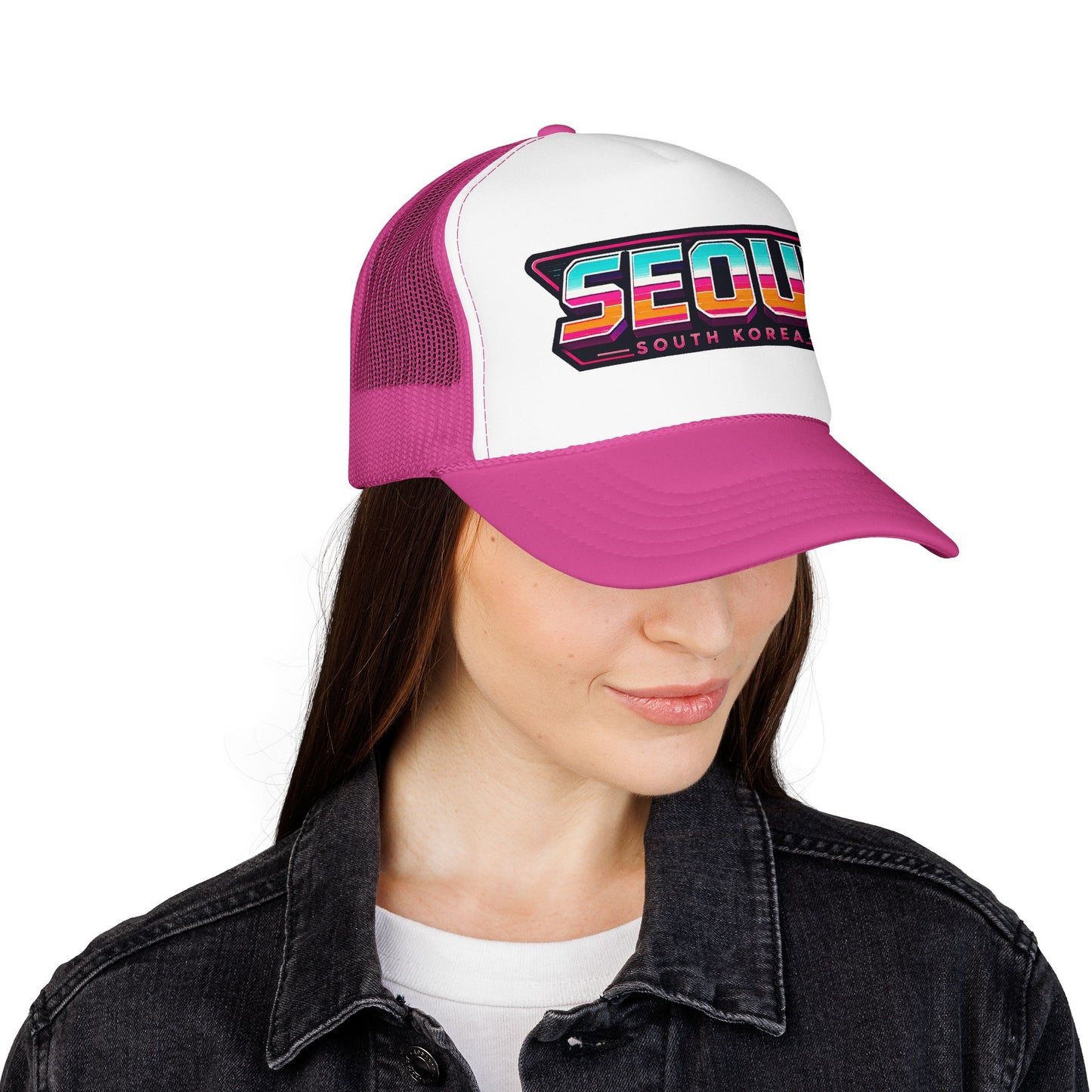 White and magenta trucker hat on model; embroidered “SEOUL SOUTH KOREA” patch logo