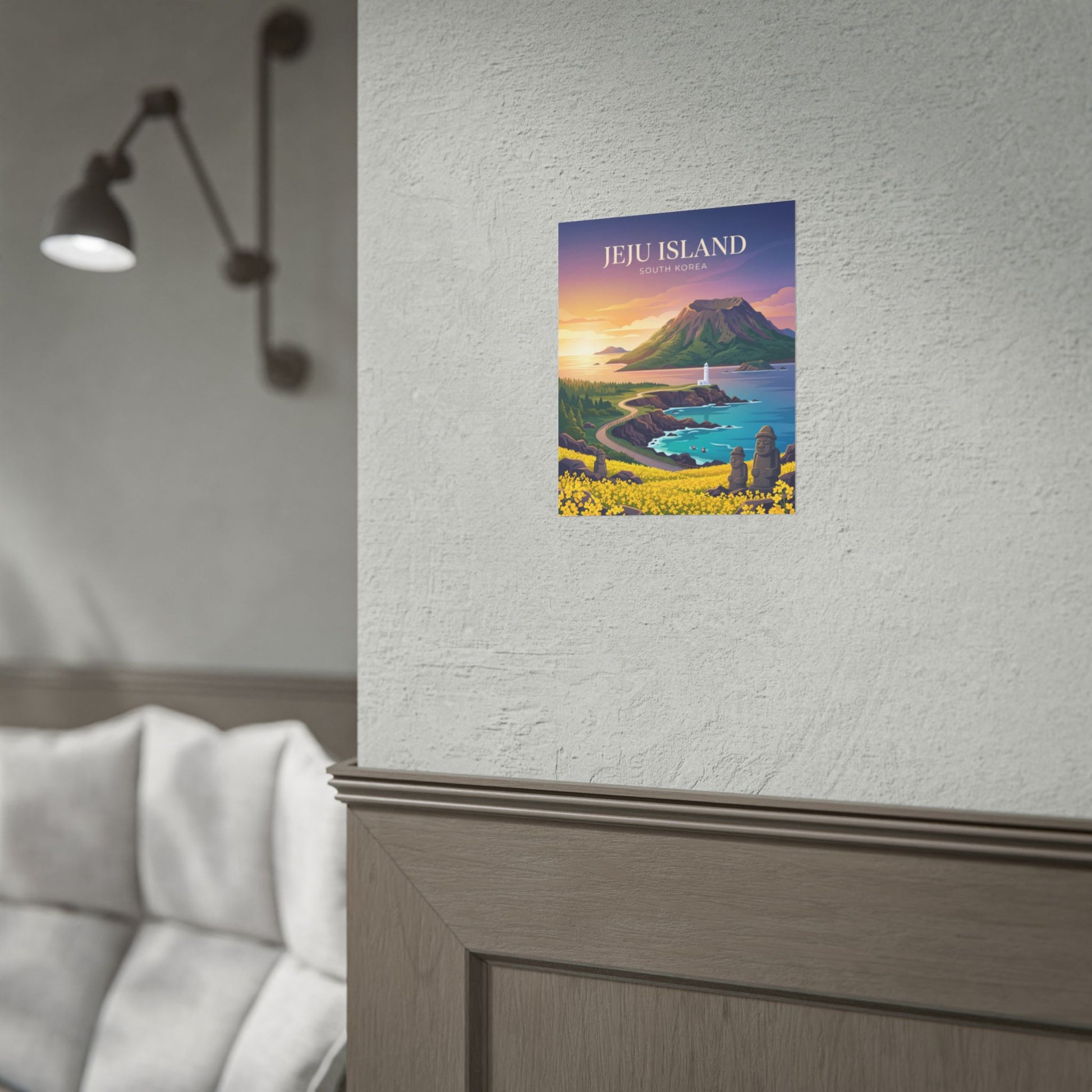 Jeju Island mini wall poster on textured white wall above a gray sofa