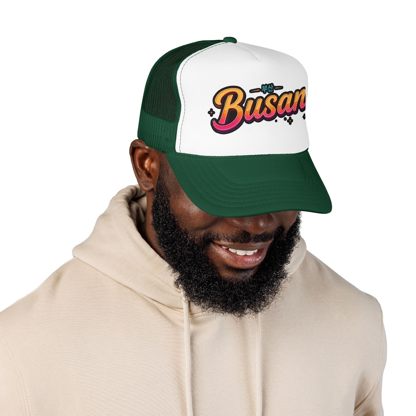 Dark green and white trucker hat with curved brim and 'Busan' logo