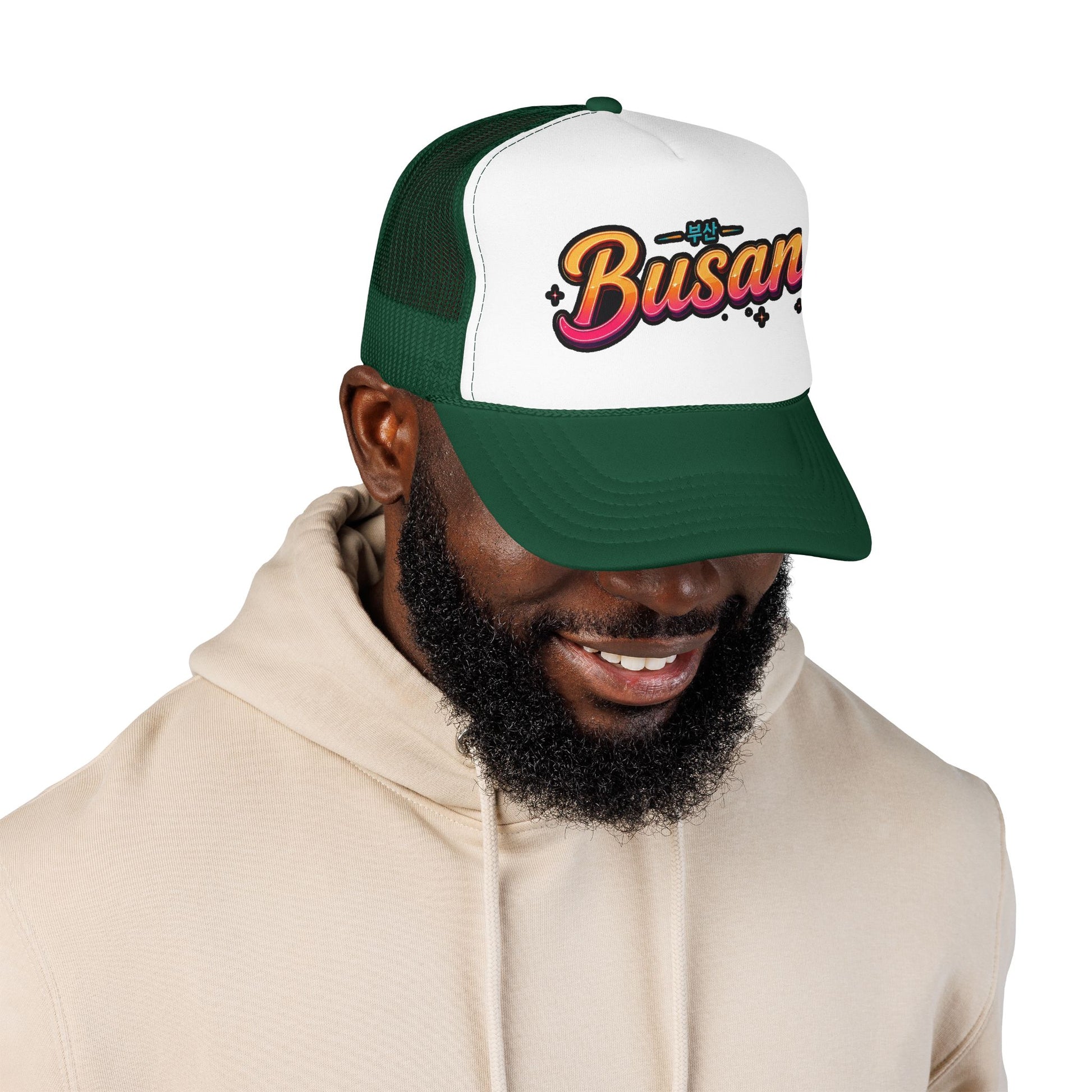 Dark green and white trucker hat with curved brim and 'Busan' logo