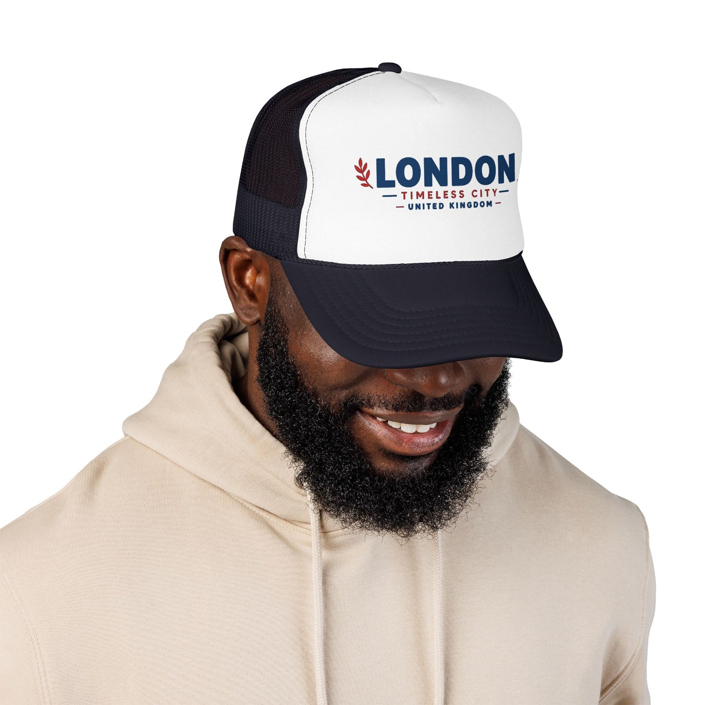 London Timbers trucker hat in white front and black mesh with LONDON logo, on model.