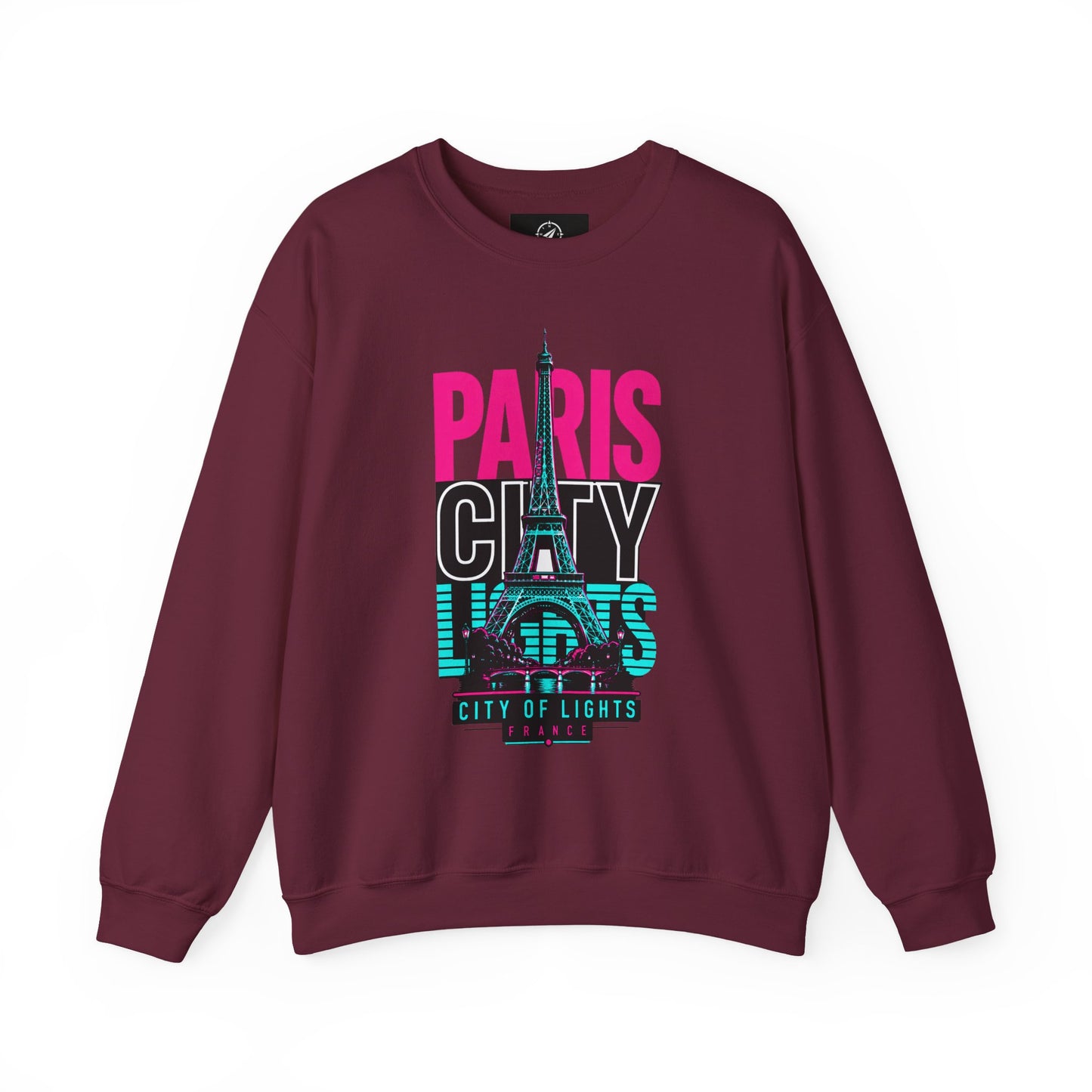 Maroon crewneck sweatshirt with PARIS CITY Eiffel Tower lights graphic in pink, teal, and white.