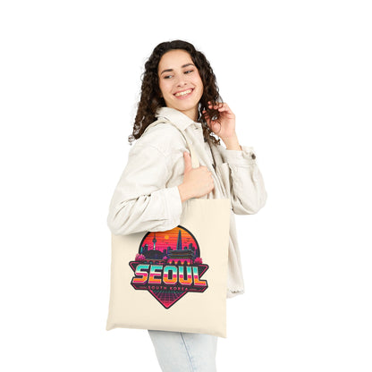 Natural canvas tote bag with bold Seoul skyline graphic and top handles