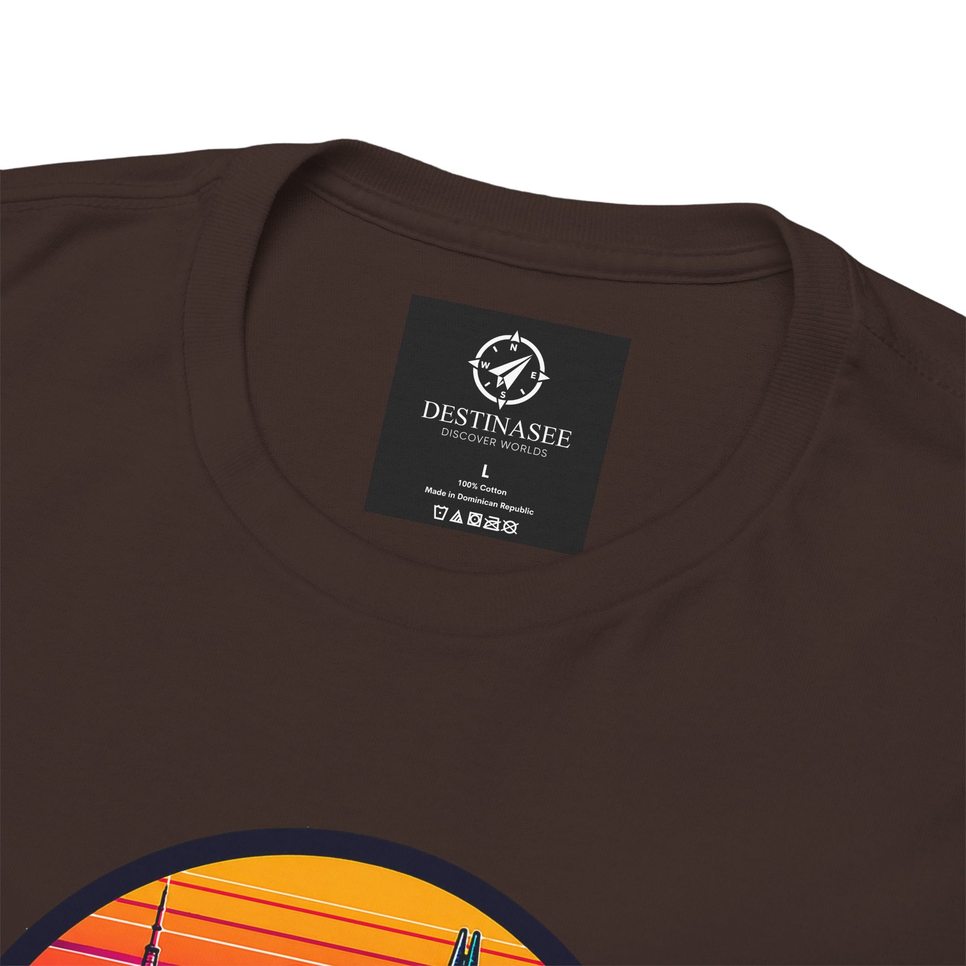 Dark brown short-sleeve T-shirt with small chest tag and partial colorful city graphic