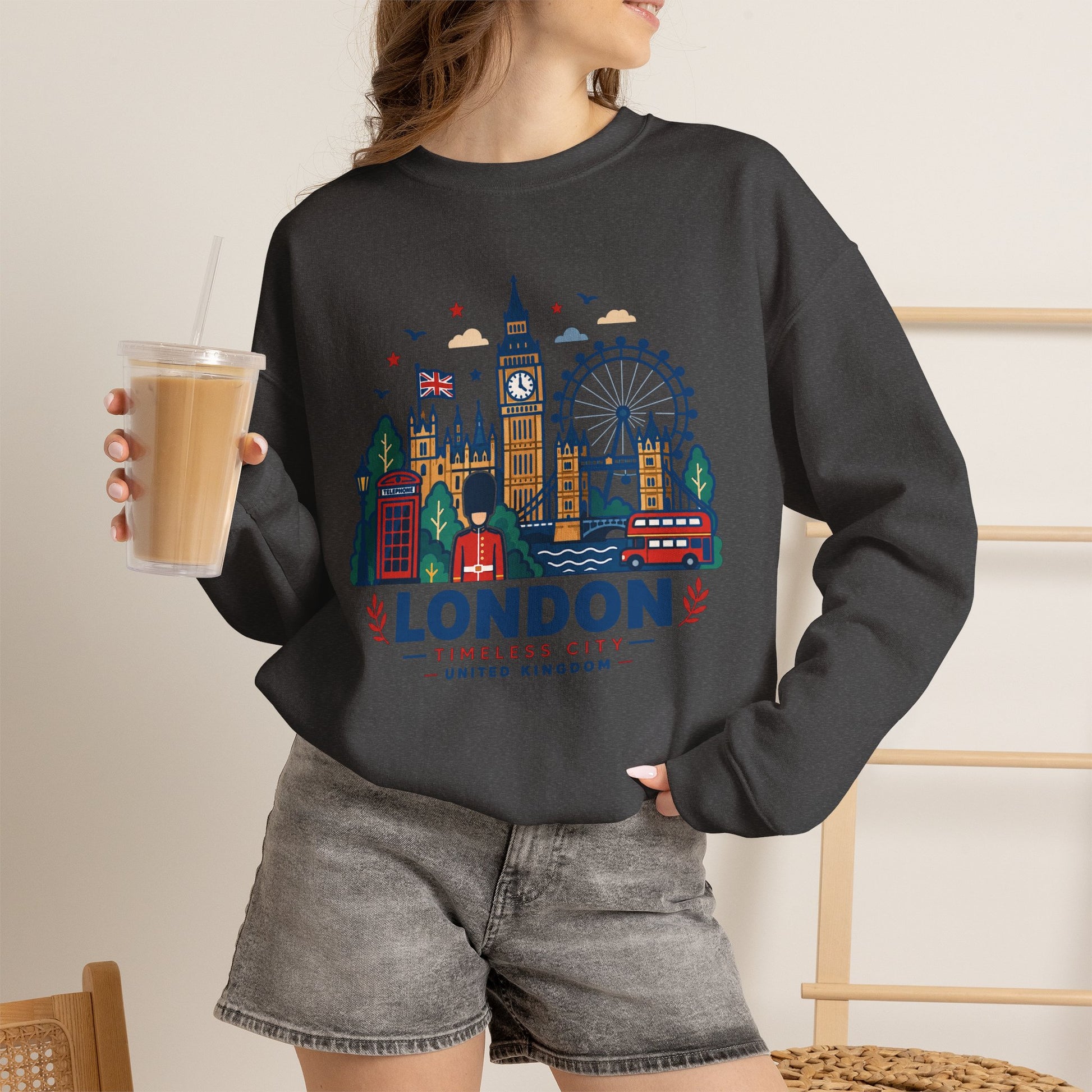 Black crewneck sweatshirt with colorful London skyline graphic and “London” logo