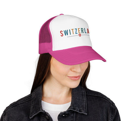 Magenta and white foam trucker cap with mesh back, side view, "SWITZERLAN" logo