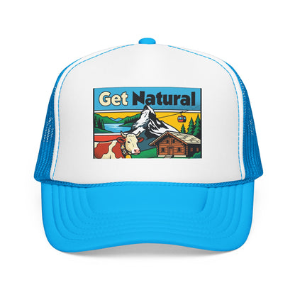 Get Natural trucker hat with Swiss landscape patch, white front and bright blue brim with blue mesh.