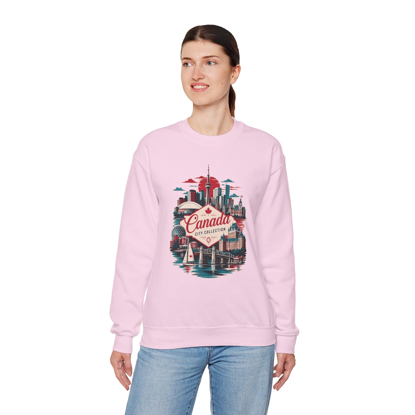 Light pink crewneck sweatshirt with multicolor Toronto Canada graphic on front.