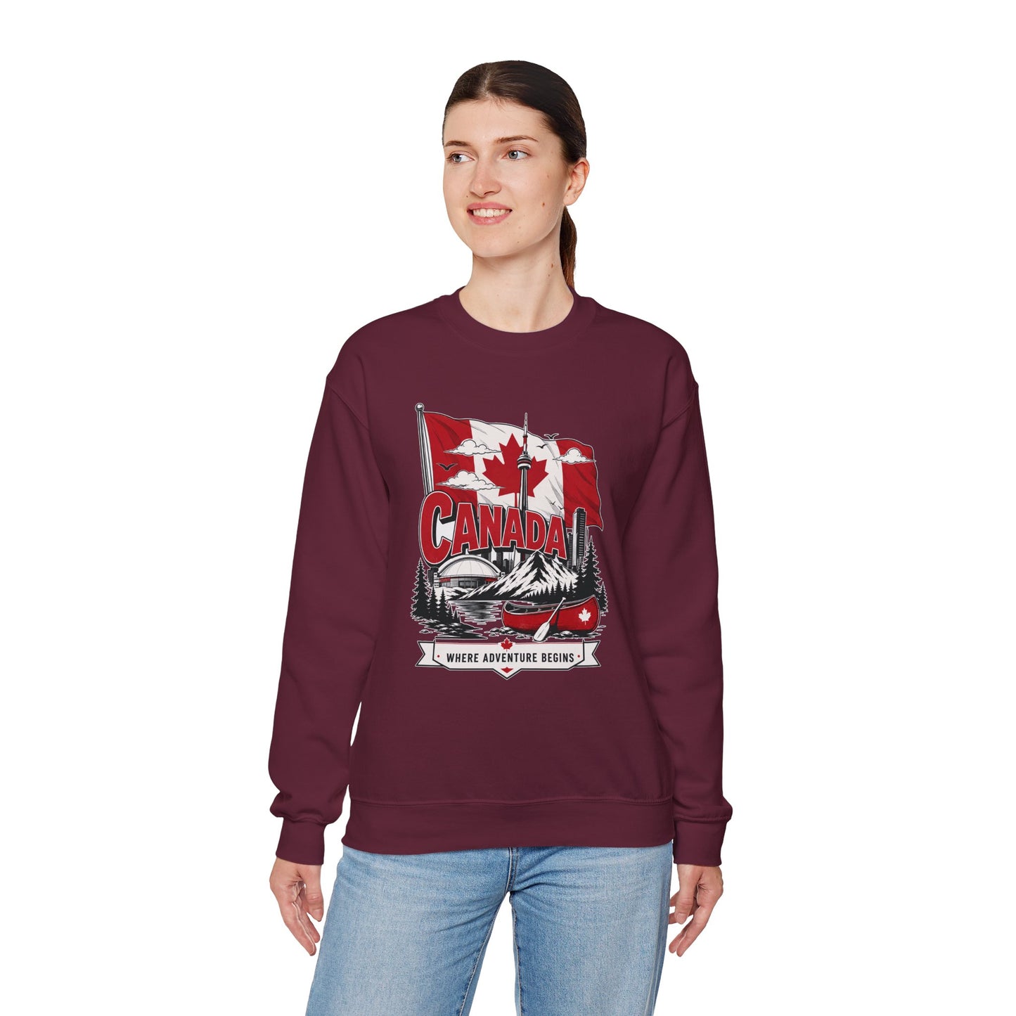Maroon crewneck sweatshirt featuring Canada flag and canoe graphic on the front.