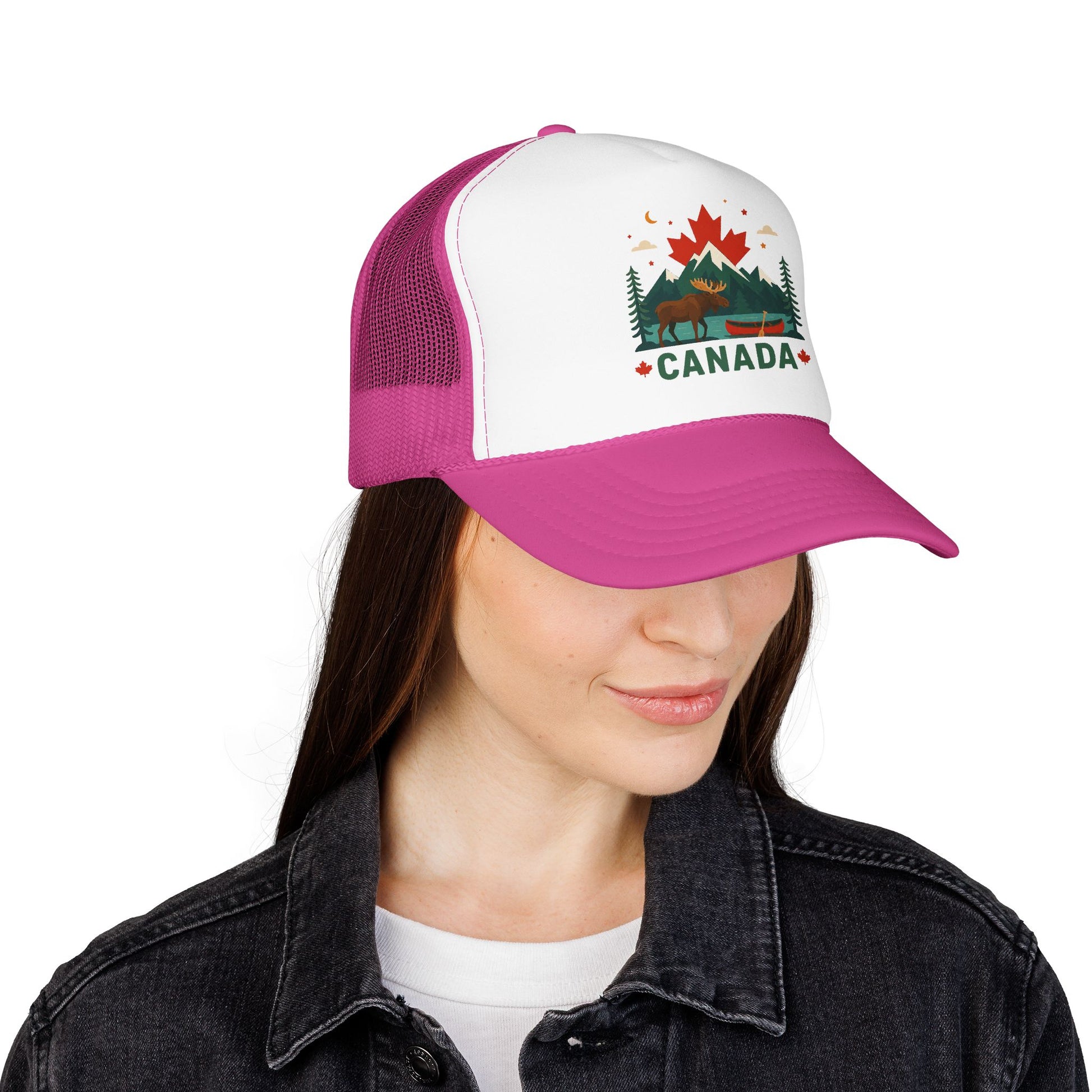 Pink and white trucker hat with mesh back and embroidered Canada logo on wearer's head