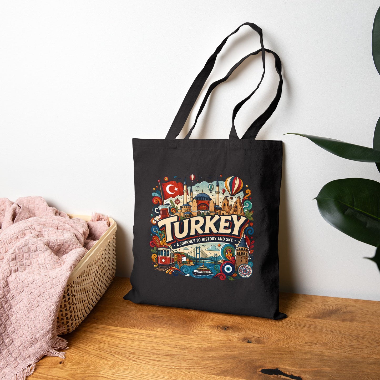Black canvas tote bag with colorful Turkey travel graphic and long handles