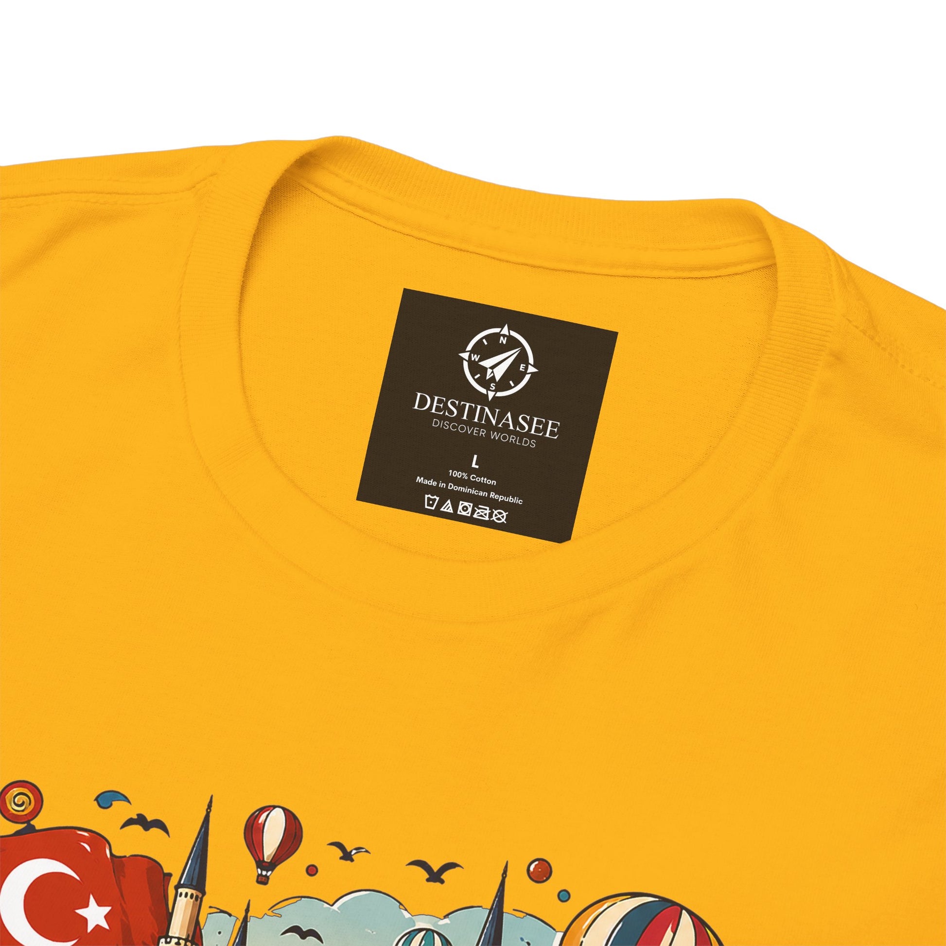 Yellow graphic tee with small chest logo label and partial colorful Turkey scene print