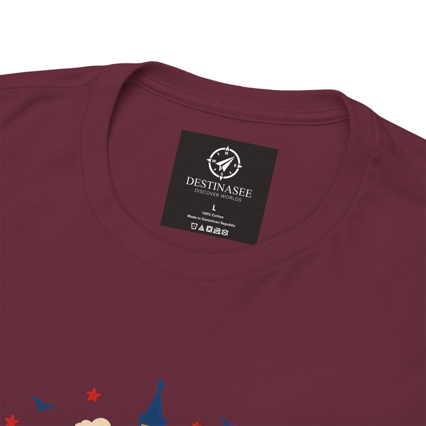 Maroon T-shirt neckline with black brand tag and partial skyline graphic