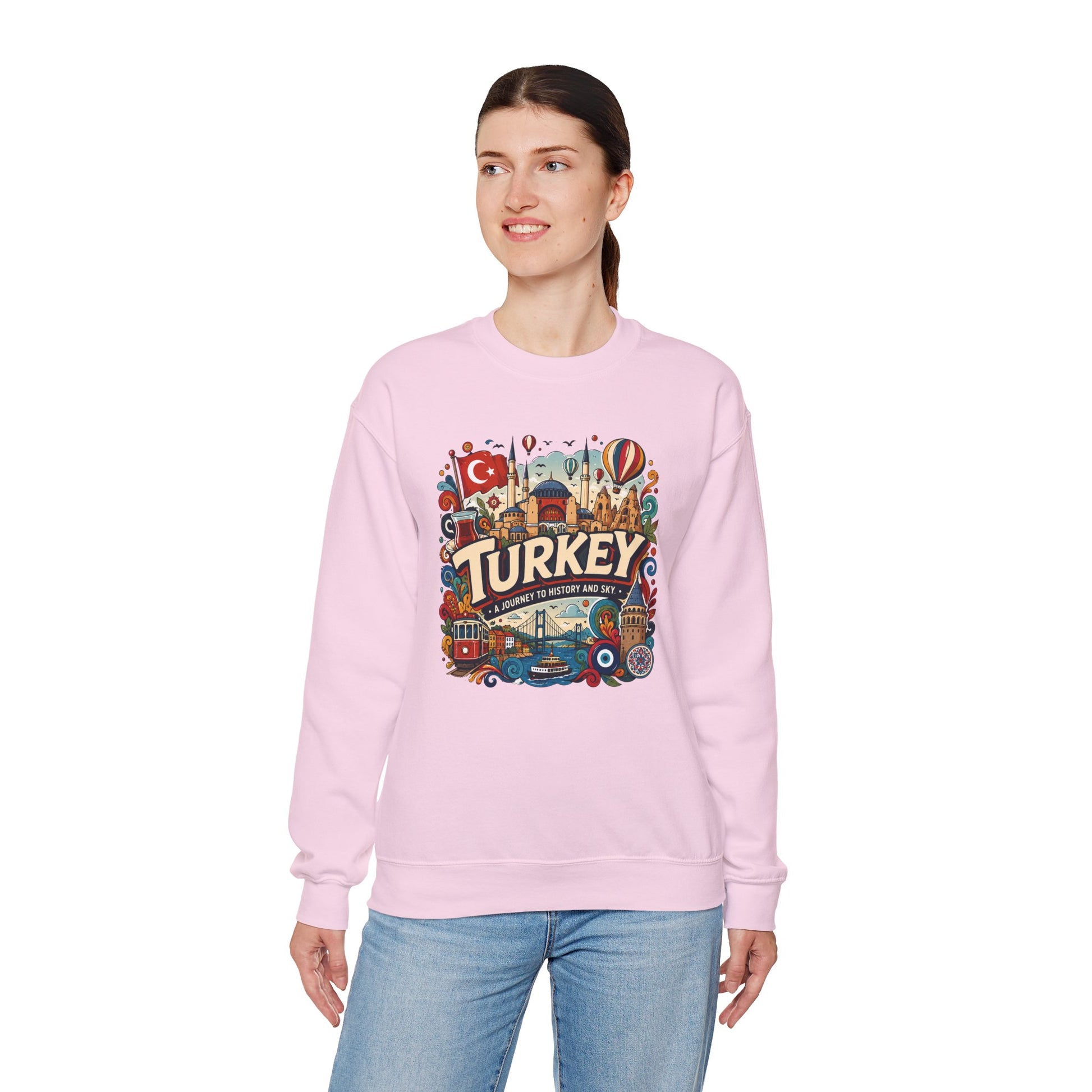 Light pink crewneck sweatshirt with colorful Turkey travel graphic on chest