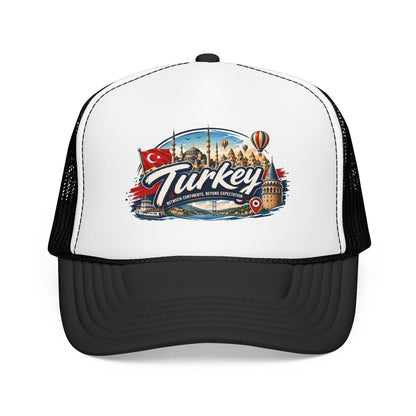 White trucker hat with black mesh sides and Turkey travel graphic patch on front