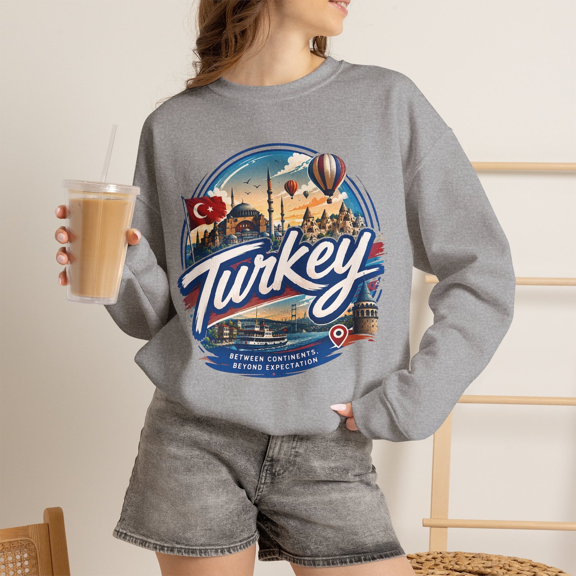 Heather gray crewneck sweatshirt with Turkey graphic, worn on model