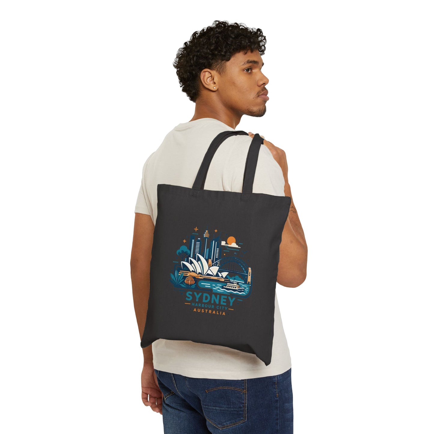Black canvas tote bag with Sydney Harbour City graphic, worn over the shoulder
