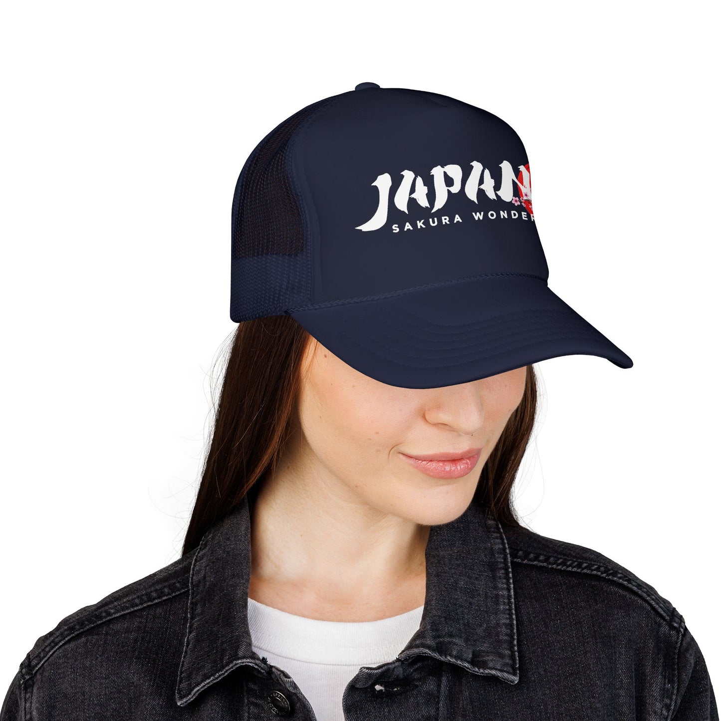 Dark navy trucker hat worn by a person, front logo visible above dark jacket.