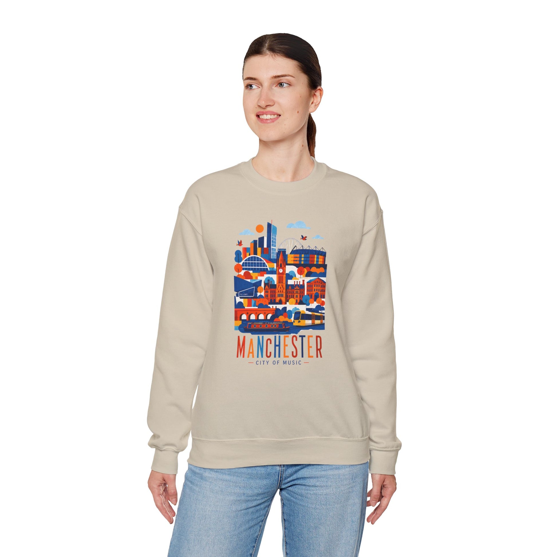 Light sand crewneck sweatshirt with Manchester city graphic, worn with jeans