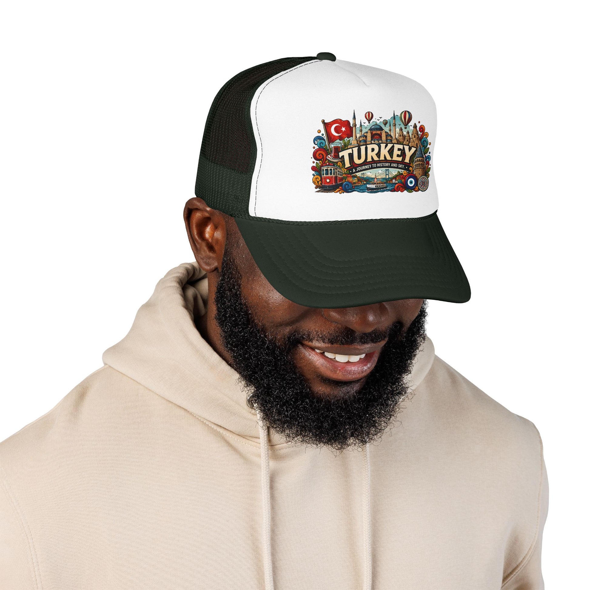 Black and white trucker hat with dark green brim on smiling man