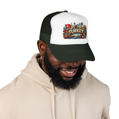 Black and white trucker hat with dark green brim on smiling man